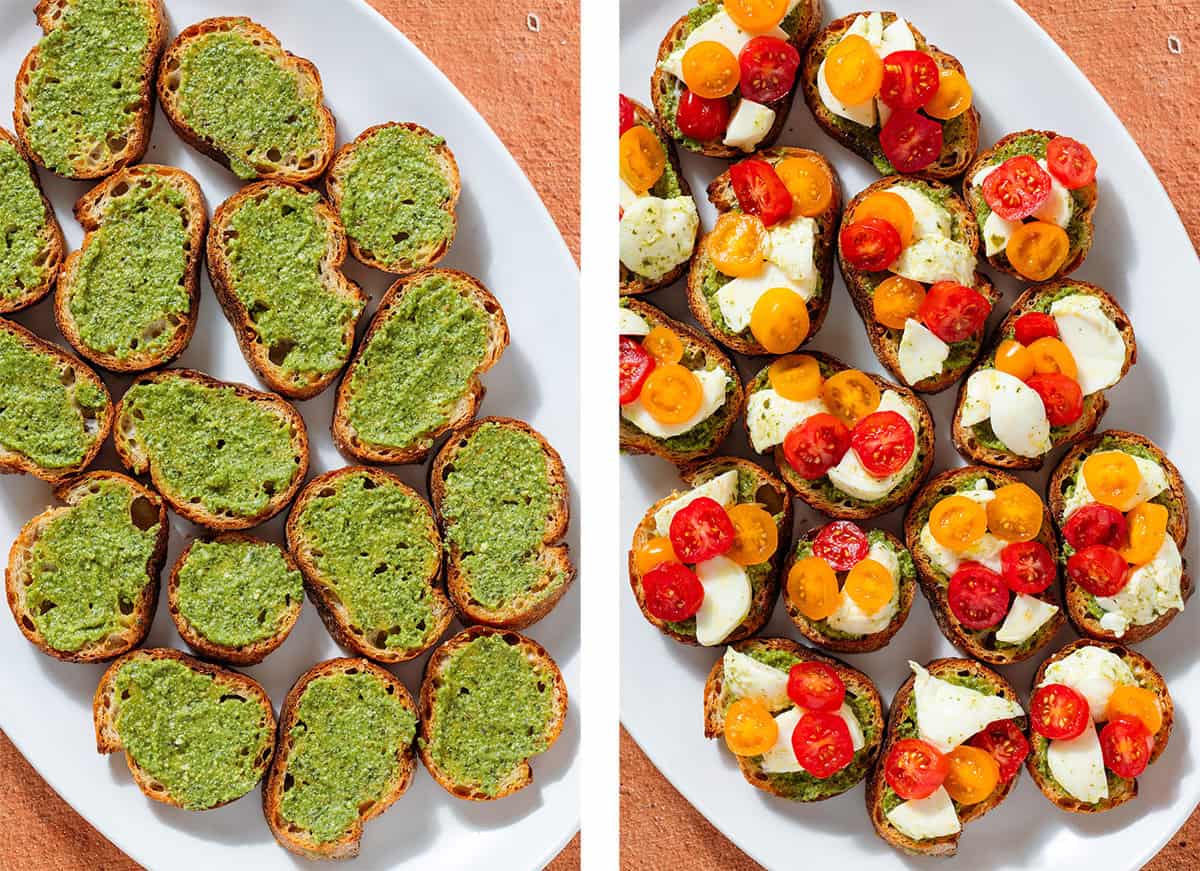 Crostinis on a large white serving plate with just pesto on the left and topped with cherry tomatoes and fresh mozzarella on the right.